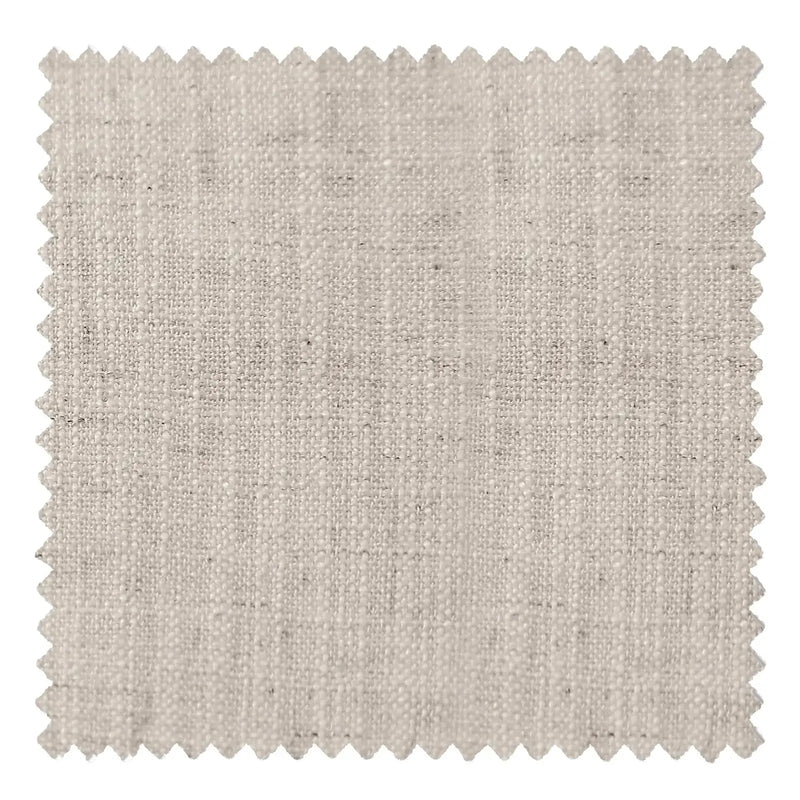 Photograph of a light greige linen-look fabric swatch featuring a textured slub weave, subtle heathered darker specks, and decorative zigzag pinking shear edges