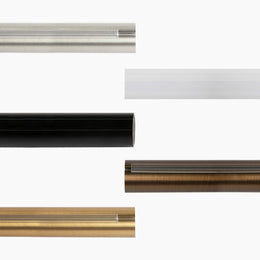 Five modern curtain rod samples displaying an integrated clear track system, including brushed nickel, black, and oil-rubbed bronze finishes