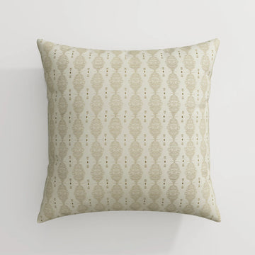 A square decorative throw pillow featuring an off-white fabric with a repeating geometric pattern of horizontal striped ovals and vertical rows of small brown arrow and diamond motifs
